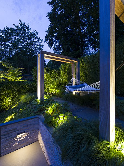 Big Scope narrow spotlight installed lighting up garden walkway.