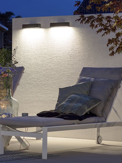 in-lite Evo Down Dark 12v light illuminating pathway and chair.