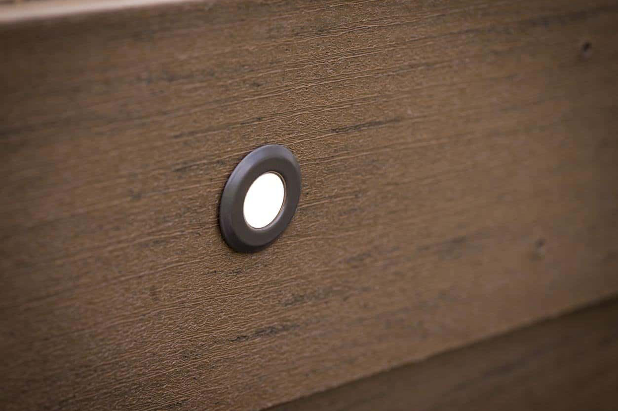TimberTech in deck light example inserted into step.
